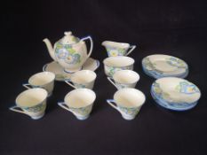 A 1930s Royal Doulton hand painted Plaza pattern part tea service to include a teapot, creamer,