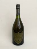 A bottle of Moet et Chandon a Epernay, Champagne Cuvee Dom Perignon, Vintage 1973. H.31cm