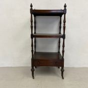 A 19th century rosewood three tier whatnot lamp or display stand with three tiers above fitted