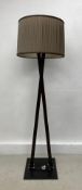 A contemporary floor standing metal framed standard lamp with pleated shade. H.176cm