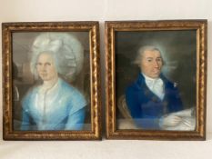 A pair of 19th century pastel portraits of a lady and gentleman in traditional dress, both framed