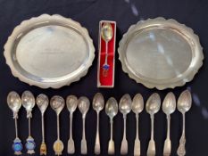 A pair of hallmarked silver presentation card trays, London 1973, along with various silver spoons