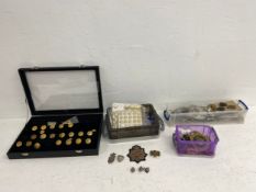 A large collection of military buttons and badges.