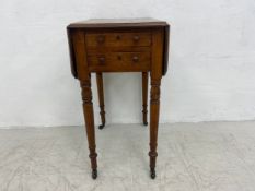 A mid 19th century oak Pembroke work or occasional table with twin drop flaps and two frieze drawers