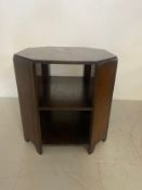 A mid century Art Deco style oak book or occasional table having an octagonal top with two