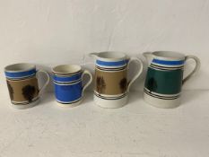 A pair of C.1900 Mochaware jugs and a smaller similar pair of mugs. H.16cm