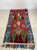 A large 20th century Moroccan or Berber Boucherouite carpet hand woven with all-over diamond lozenge