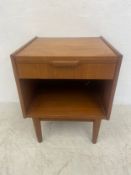 A mid-century Danish teak bedside cabinet in the style of Gunnar Nielsen having a square top with