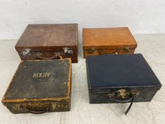 A collection of four vintage leather cases, one with double hinges revealing a fitted base