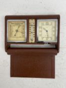 An Art Deco LeCoultre for Aspreys travel clock, barometer and thermometer in folding leather case.