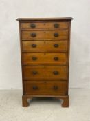 A 19th century mahogany and satinwood inlaid tall chest of six graduating drawers on shaped