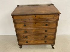 An unusual Regency rosewood davenport having a rectangular slope with sliding action and secret