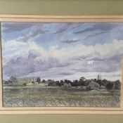 A 20th century watercolour depicting a country landscape with a castle ruin and a cathedral in the