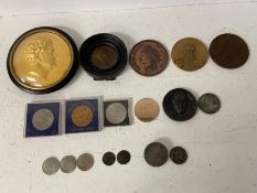 Two framed relief profile plaques along with a miscellaneous collection of coins.