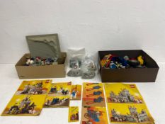 a miscellaneous collection of lego with instructions.