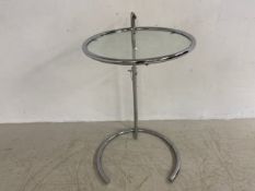 A vintage glass and tubular chrome side or occasional table with adjustable height by Elieen Gray