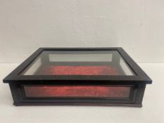 A 19th century table top vitrine having five glazed panels in a carved and ebonised mahogany frame