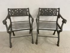A pair of heavy Neoclassical style cast iron garden armchairs in the style of Karl Friedrich