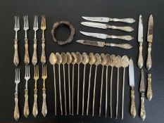 A collection of continental silver and white metal items, cocktail stirrers, a bracelet and silver