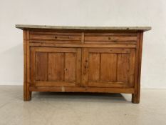 A late 19th century pine sideboard having a rectangular marble top over two frieze drawers and two