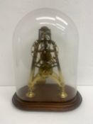 A skeleton clock with gilt metal plates of pylon form, cord driven fusee movement under blown