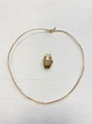 A 14ct gold choker (tests as 14k) and a watch case marked 14k (without strap) 12.89g gross