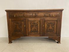 A late 19th century oak sideboard with rectangular top over an arrangement of two frieze drawers and