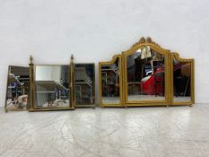 A vintage carved giltwood triptych dressing table mirror along with a similar brass mirror.