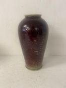 A contemporary Chinese flambe glazed sang de boeuf vase with marks in underglaze blue to the base.