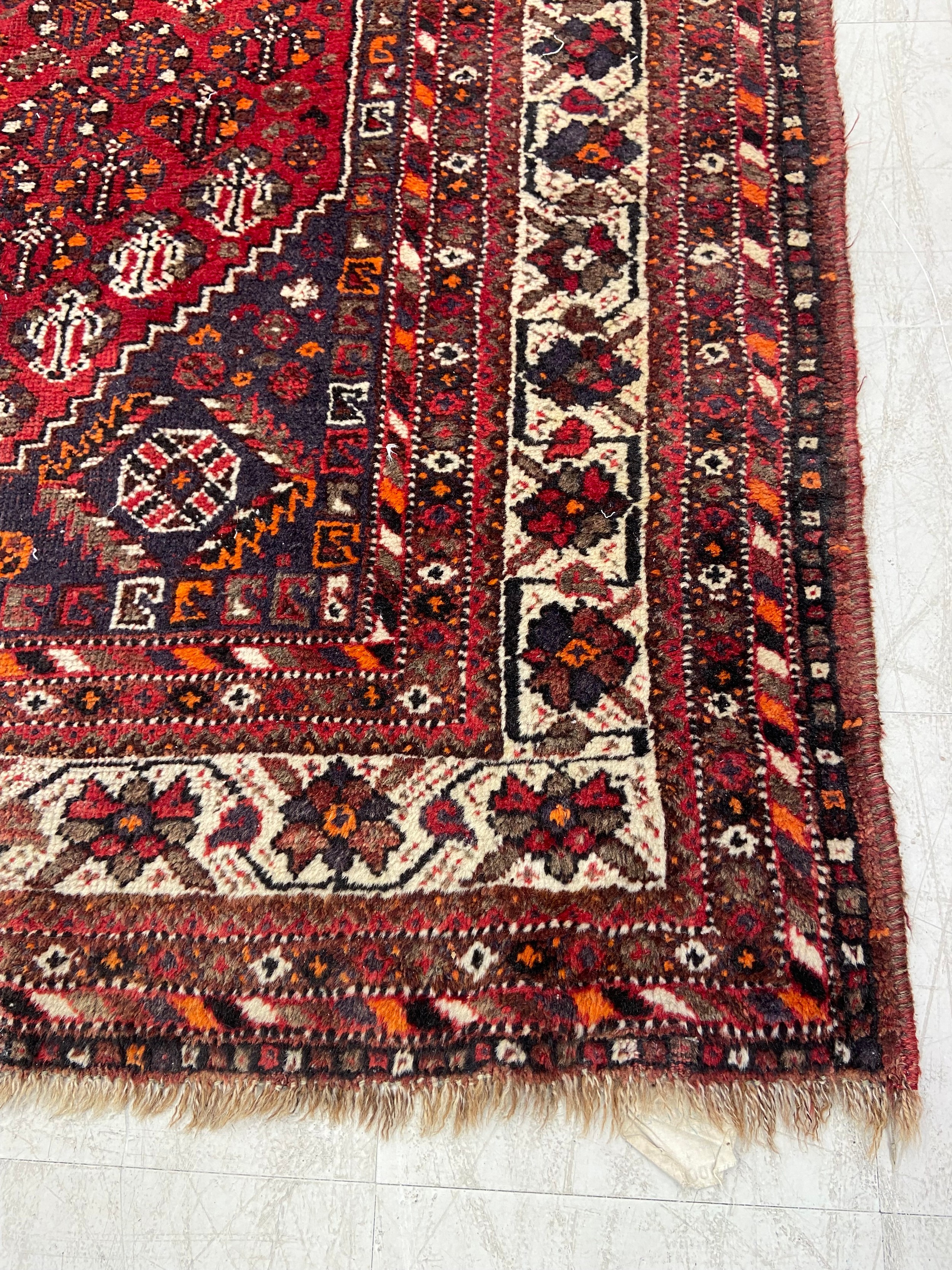A Shiraz carpet with triple central pole medallions with stylised flowerhead motifs across the - Image 2 of 4