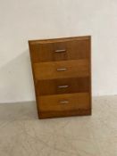 A mid-century teak chest of four short drawers with maker's plaque. H.76 W.54 D.46cm. (Low cost in-