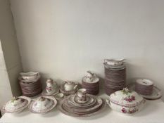 A large KPM Berlin porcelain dinner service to include three lidded tureens, two gravy boats, a