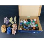 A collection of mineral and polished stone bunches of grapes and eggs, marble onyx and others etc.
