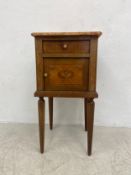 An early 20th century French kingwood marble topped bedside cabinet with satinwood foliate marquetry