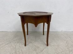 An early 20th century French walnut occasional table with segment veneered top on slender cabriole