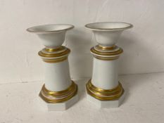 A pair of 19th century German KPM urns with gilt highlighted decoration, marked to base. H.20cm