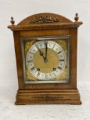 A German Cenzkirch walnut cased mantel clock with eight day movement in the Georgian style. H.31cm