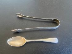 A silver tea spoon with feather edge and bottom-struck maker's marks along with a pair of possibly