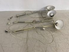Three vintage articulated anglepoise style lamps to include two wall mounted and one with table