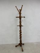 A 19th century Continental style turned beech and barleytwist coatstand on cabriole supports. H.