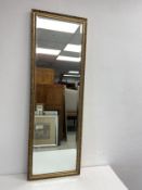 A vintage gilt framed dressing mirror with bevelled plate. 126x42cm. (Low cost in-house delivery