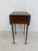 A 19th century mahogany occasional table having a rosewood crossbanded top with two drop leaves over