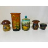 A miscellaneous collection of five various Russian hand decorated lacquered papier mache lidded