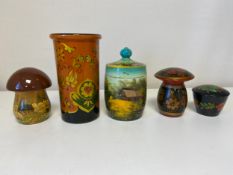 A miscellaneous collection of five various Russian hand decorated lacquered papier mache lidded