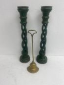 A pair of large carved and painted pricket candlesticks along with a brass doorstop. H.59cm.