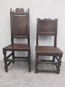 Two 17th century oak hall or dining chairs with panelled backs and seats on stretchered supports.