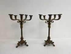 A pair of C.1900 gilt metal table candelabras each with five scrolling branches on fluted columns
