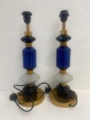 A pair of Art Deco style brass and blue glass table lamps. H.53cm.