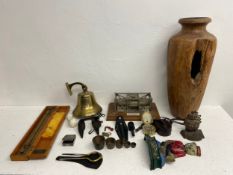 A miscellaneous collection to include a vintage ship's bell, cast iron doorstops, compass etc. H.