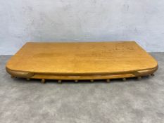 A 1960's Gucci wall fitting brass framed and lacquered maple display rack with ten extending rods